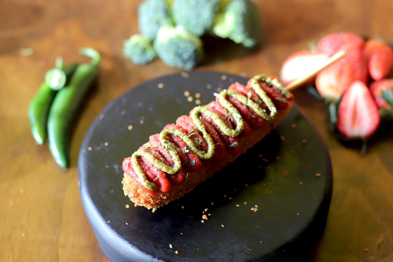 A Korean corn dog with fresh ingredients